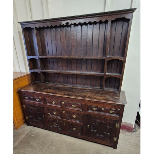 122A - A William III and later oak geometric moulded dresser