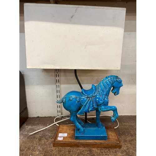 376 - A brass lamp and a Chinese tang style blue porcelain horse shaped table lamp