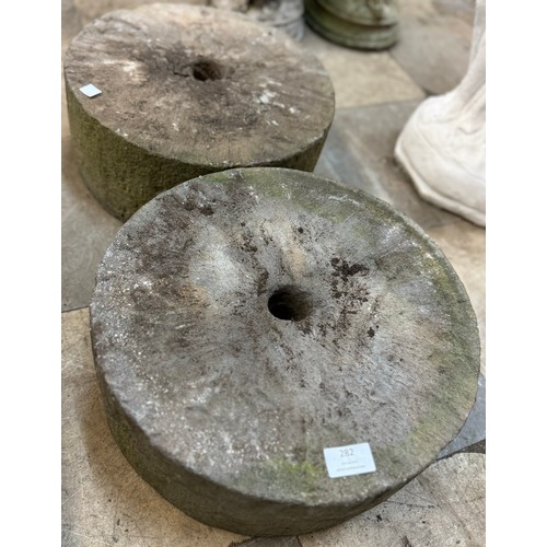 282 - A pair of concrete mill stones