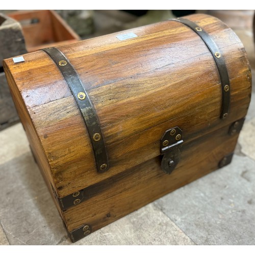 284 - A small hardwood dome top treasure chest