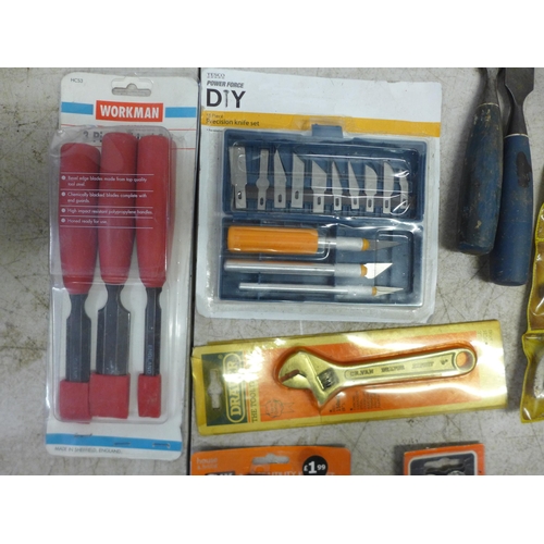 2045 - A box of hand tools including Workman chisels, pliers, craft knives, Worldwide 2 1/2” blade mains te... 