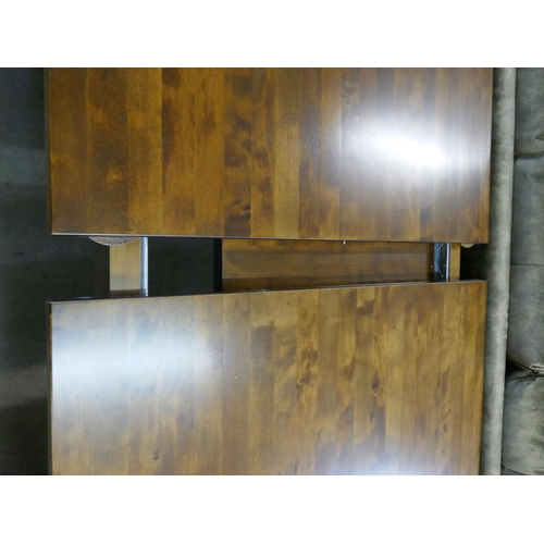 1337 - A dark brown Garrat extending dining table  *This lot is subject to VAT RRP £1139
