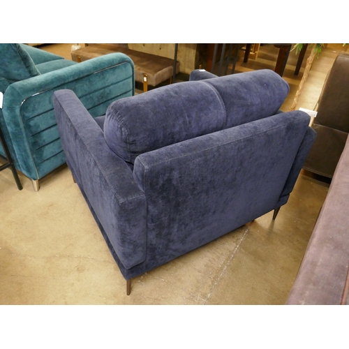 1340 - A deep blue velvet oversized  armchair  * This lot is subject to VAT