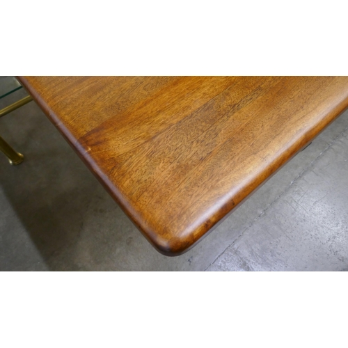 1361 - A solid hardwood and steel dining table  *This lot is subject to VAT