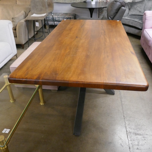 1361 - A solid hardwood and steel dining table  *This lot is subject to VAT