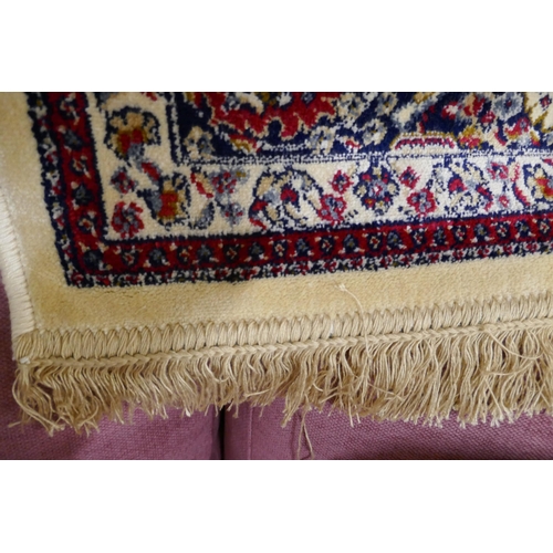 1369 - A rich red ground cashmere rug (95x130cm)