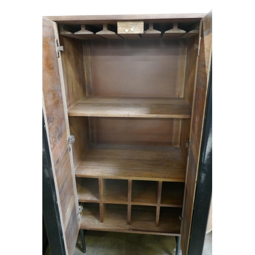 1424 - An oval railway sleeper two door drinks cabinet  *This lot is subject to VAT