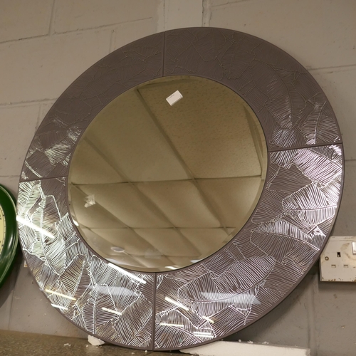 1429 - A circular bevelled edge mirror with banana leaf design