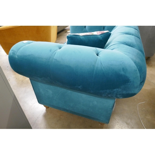 1445 - A turquoise velvet Chesterfield love seat RRP £1129