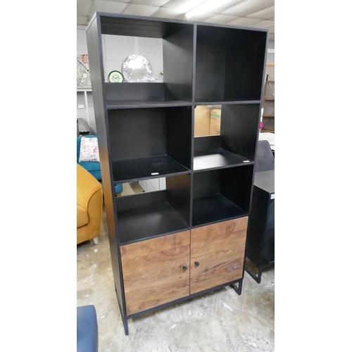 1447 - A black and grooved hardwood shelving unit  *This lot is subject to VAT