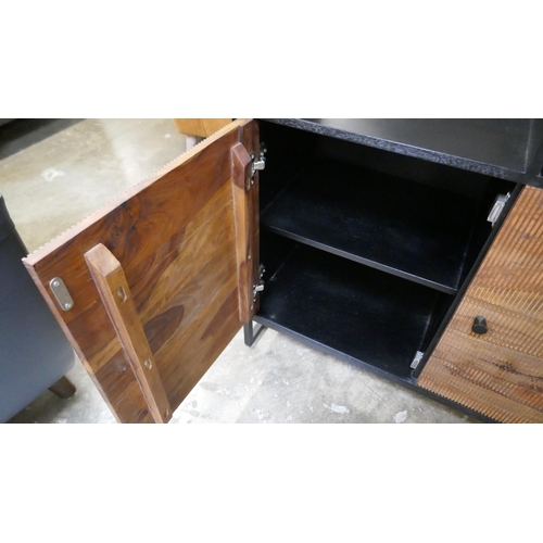 1447 - A black and grooved hardwood shelving unit  *This lot is subject to VAT