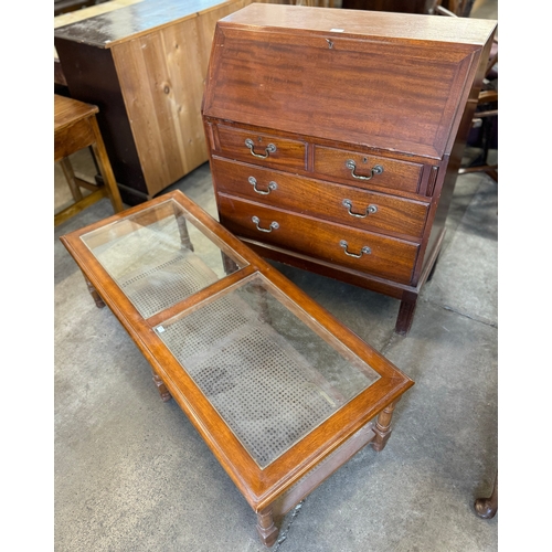 250 - A mahogany bureau and an oak glass topped coffee table