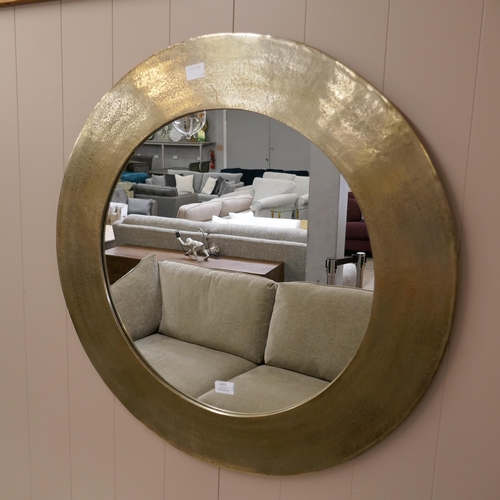 1473 - A gold circular mirror