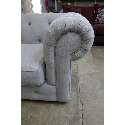 1493 - A grey upholstered Chesterfield corner sofa RRP £1899