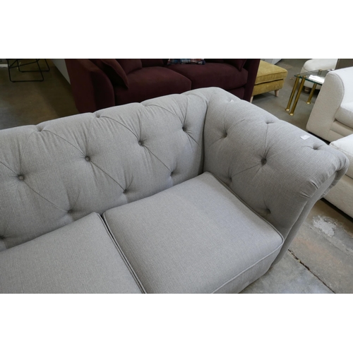 1493 - A grey upholstered Chesterfield corner sofa RRP £1899