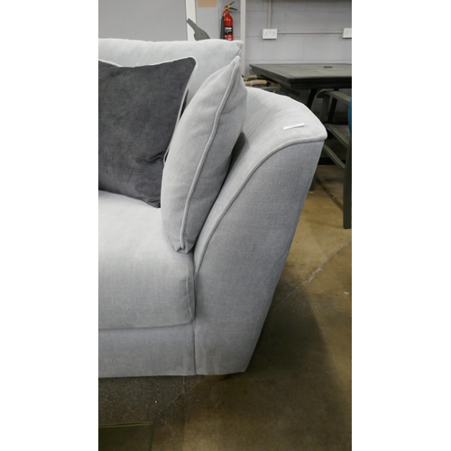 1499 - A grey velvet three seater sofa