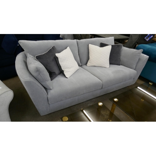 1499 - A grey velvet three seater sofa