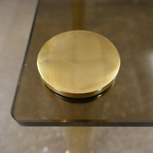 1501 - A square occaisional table with a solid brass base and a smoked tempered glass top