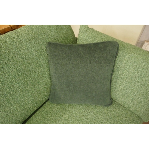 1505 - A vibrant green upholstered 2.5 seater sofa on a semi exposed frame RRP £1999