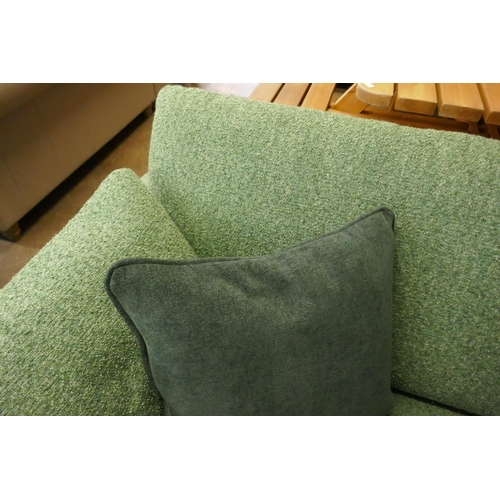 1505 - A vibrant green upholstered 2.5 seater sofa on a semi exposed frame RRP £1999