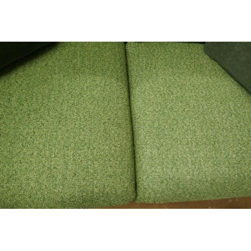 1505 - A vibrant green upholstered 2.5 seater sofa on a semi exposed frame RRP £1999