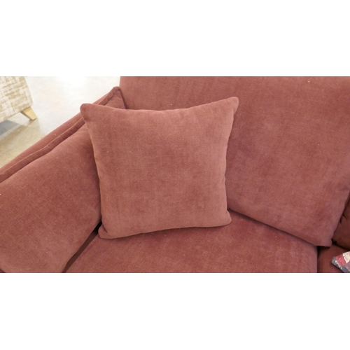 1507 - A burgundy velvet three seater sofa