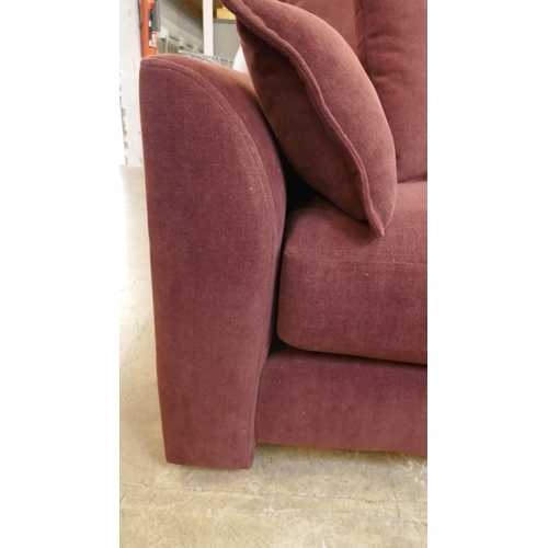 1507 - A burgundy velvet three seater sofa