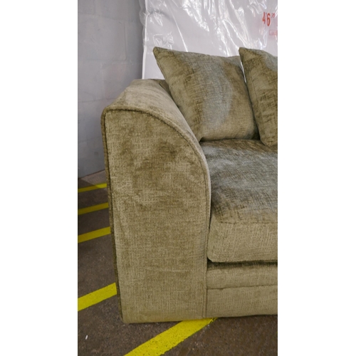 1520 - A green velvet three seater sofa