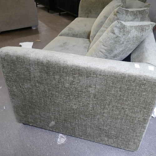 1520 - A green velvet three seater sofa