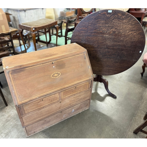 259 - A George III oak tripod tilt top table and an inlaid mahogany bureau