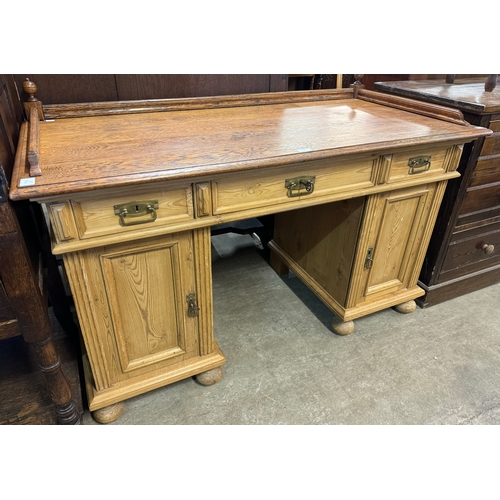 228 - A 19th Century style French pine and oak pedestal desk