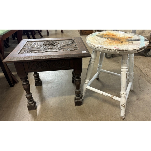 300 - An early 20th Century carved oak sewing stool and a Victorian painted kitchen stool