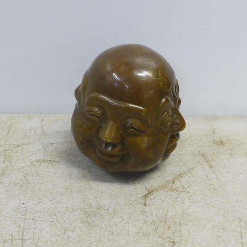 2099 - A brass Buddha head ornament - marked with Chinese symbols to base