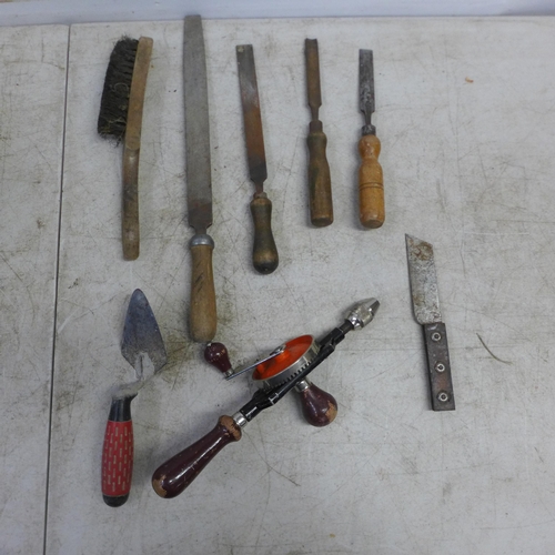 2059 - A large quantity of assorted hand tools including files, planes, chisels, spanners, a hand drill, wi... 