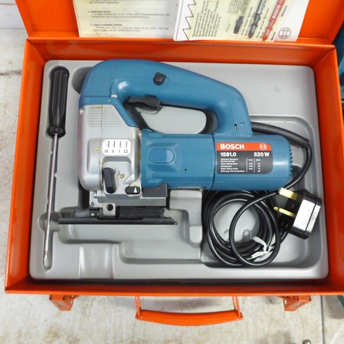 2061 - A Bosch 1581.0 240v electric jigsaw, a Record V75 in box and a Wolf type 