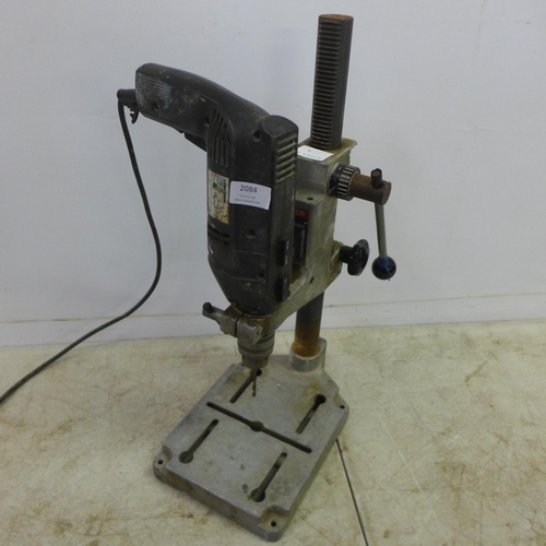 2084 - A Bosch drill stand with a Black and Decker Professional P2270 240v power drill