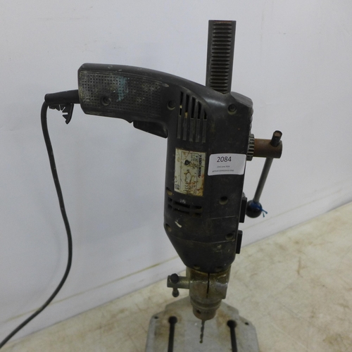 2084 - A Bosch drill stand with a Black and Decker Professional P2270 240v power drill