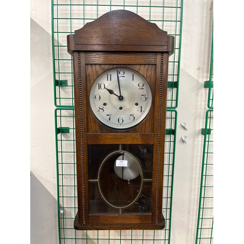 377 - An oak Westminster chime wall clock