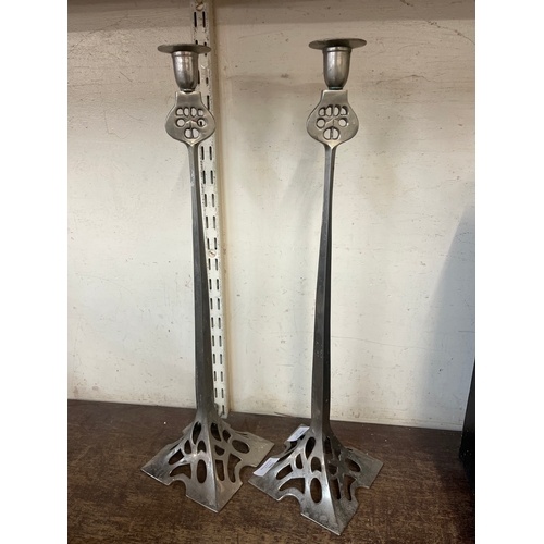 386 - A pair of tall Art Nouveau style candlesticks