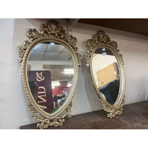 388 - A pair of gilt framed heart shaped mirrors