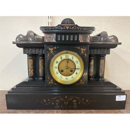 389 - A 19th Century French Belge noir and marble architectural cased mantle clock