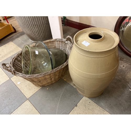 390 - A basket with assorted glass jars and a water dispenser