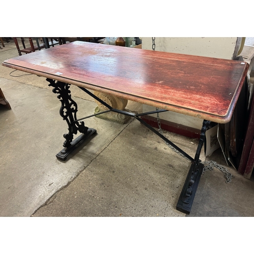 306 - A mahogany and cast iron based pub table