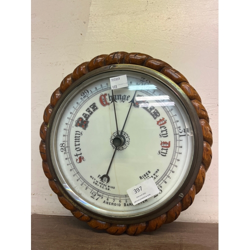397 - An early 20th Century oak aneroid barometer