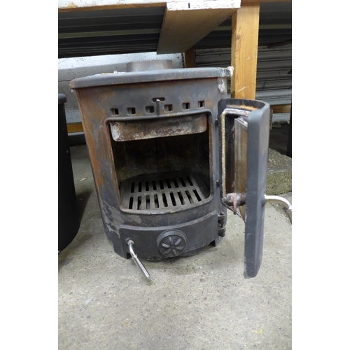 2202 - Two Clarke cast metal solid fuel burning stoves (8037/8038) * this lot is sold as scrap + VAT*