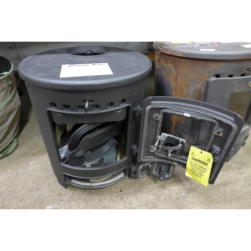 2202 - Two Clarke cast metal solid fuel burning stoves (8037/8038) * this lot is sold as scrap + VAT*