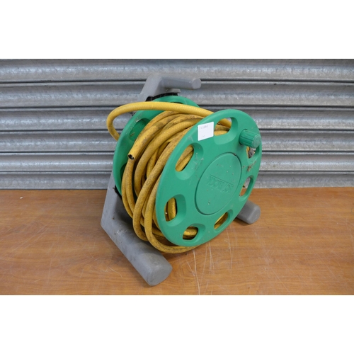 2203 - A Hozelock hose pipe and reel