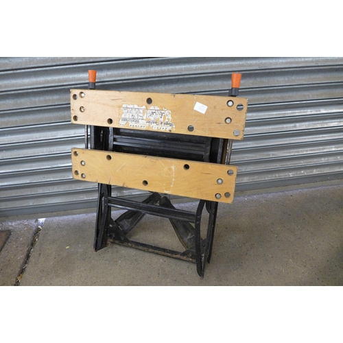 2213 - A pair of wooden folding trestle stands and a Black & Decker Workmate folding work bench