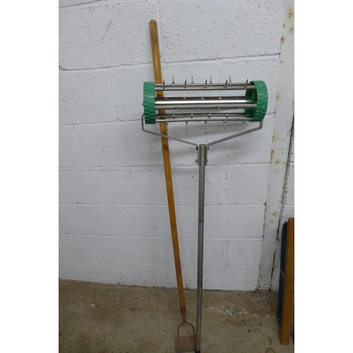 2221 - A bundle of garden tools and other items including an aerator, rakes, hoes, shears, a wooden sled, p... 