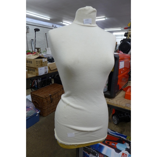 2230 - A dress makers mannequin on stand